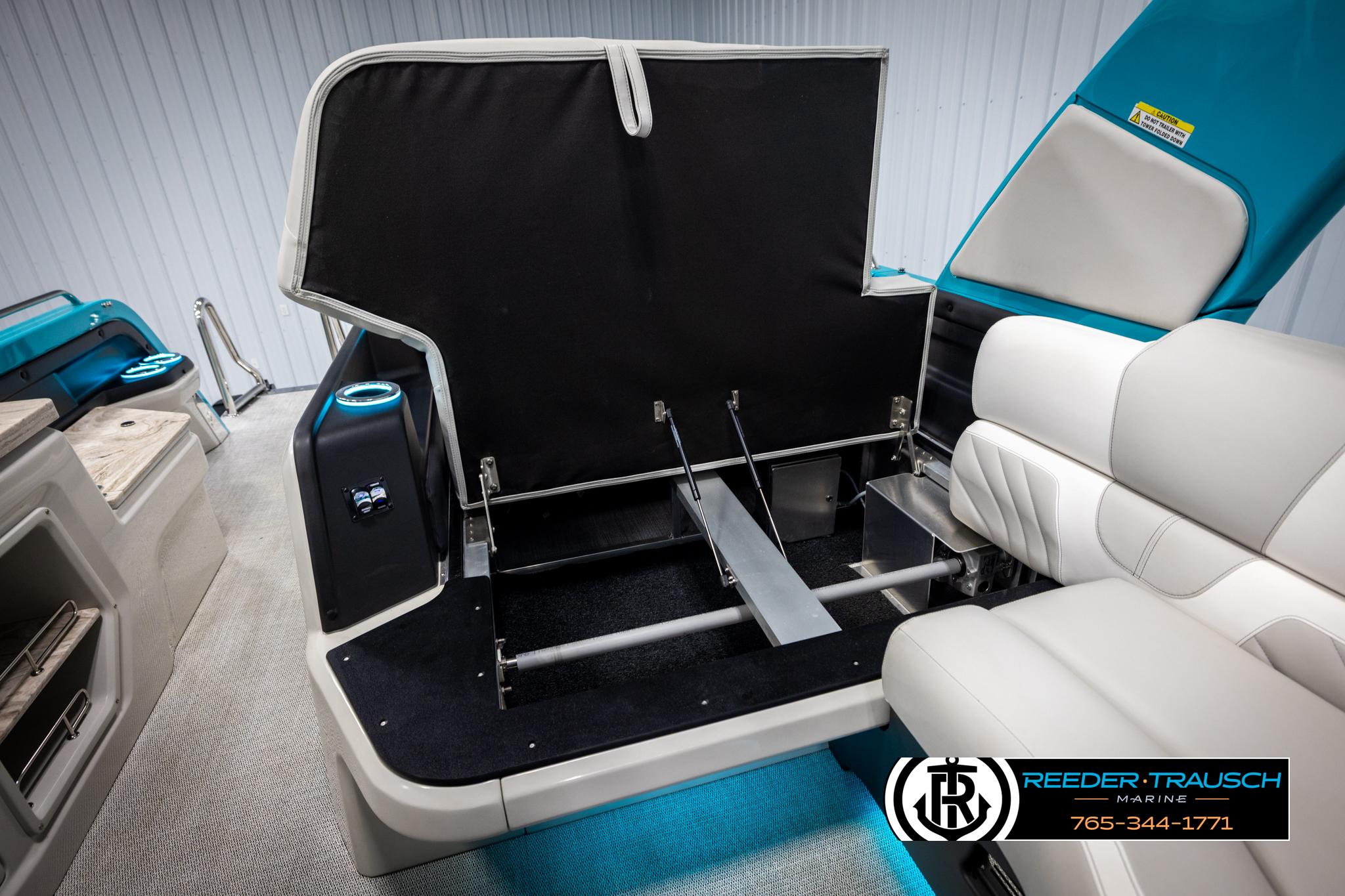 2025 Avalon 2585 Excal VRBW boat interior with open storage compartment and seating.