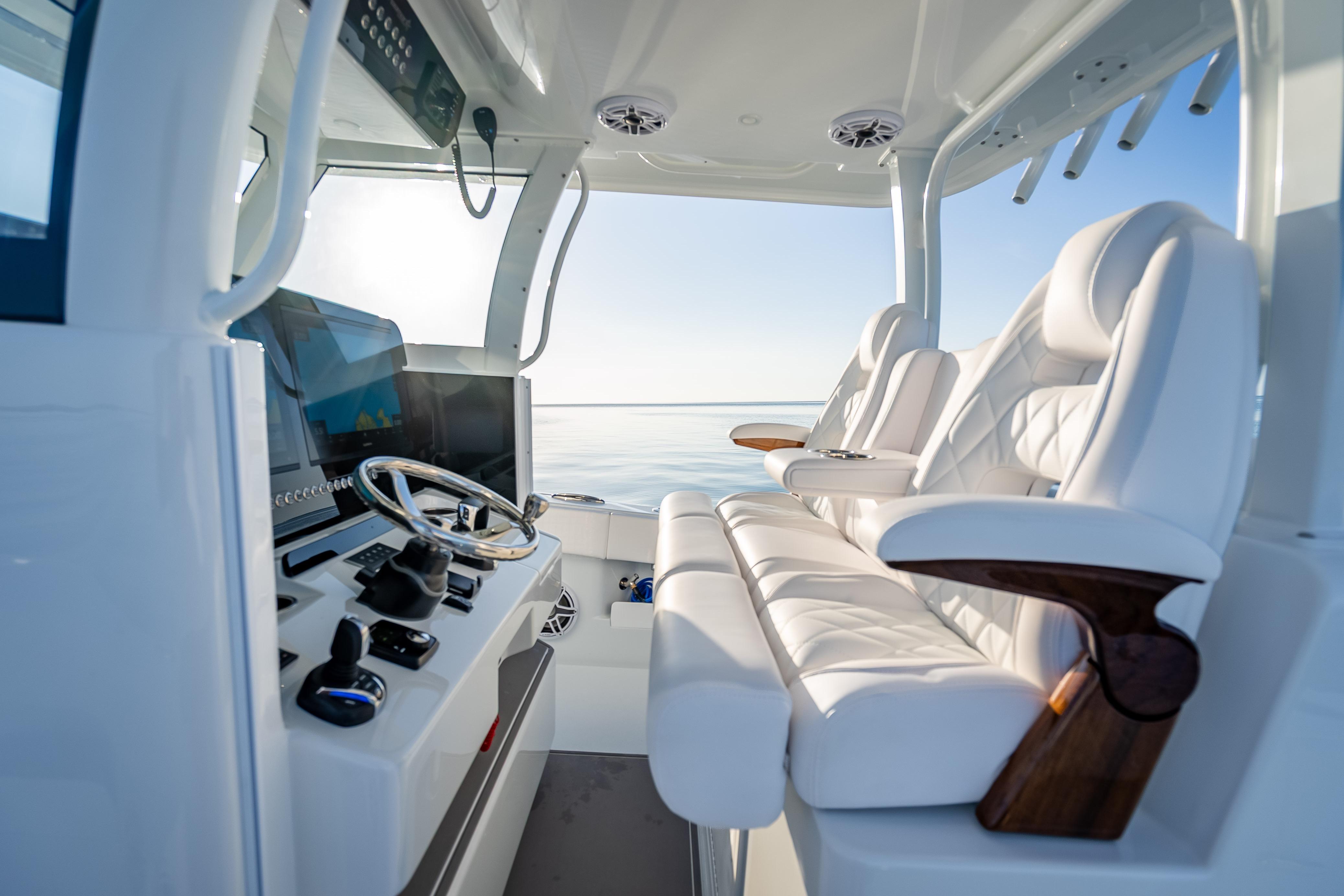 Luxurious interior of 2026 Freeman 35 boat with plush seating and modern controls.