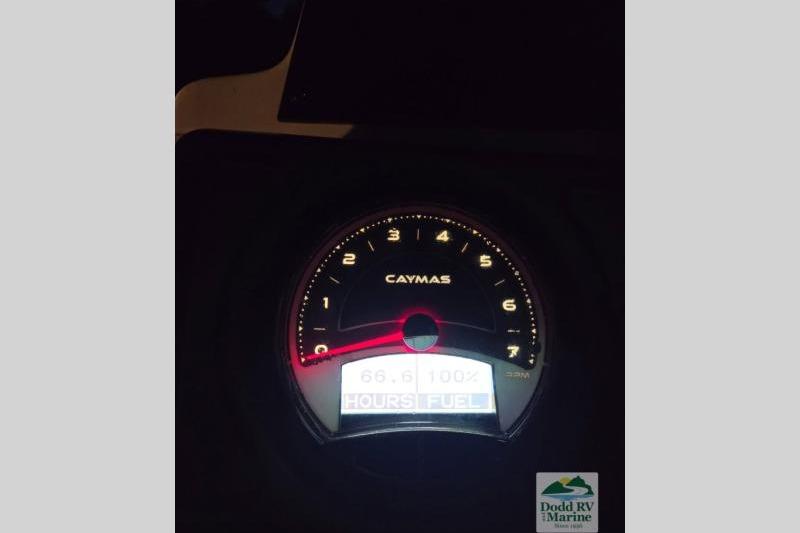 Dashboard of 2021 Caymas CX 18 SS boat showing tachometer and fuel gauge.