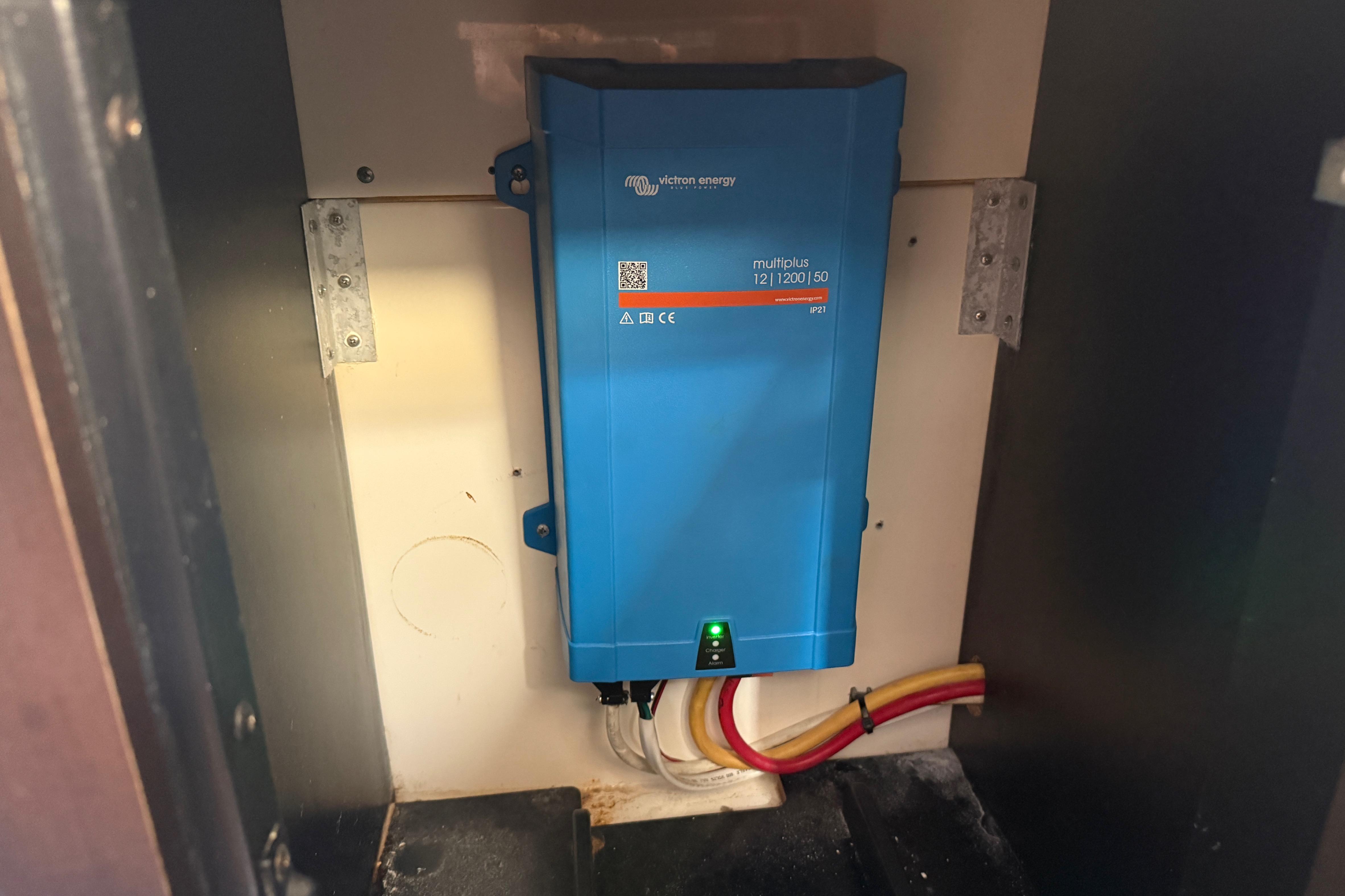 Blue Victron Energy MultiPlus inverter in a 2019 Scout 355 LXF boat compartment.