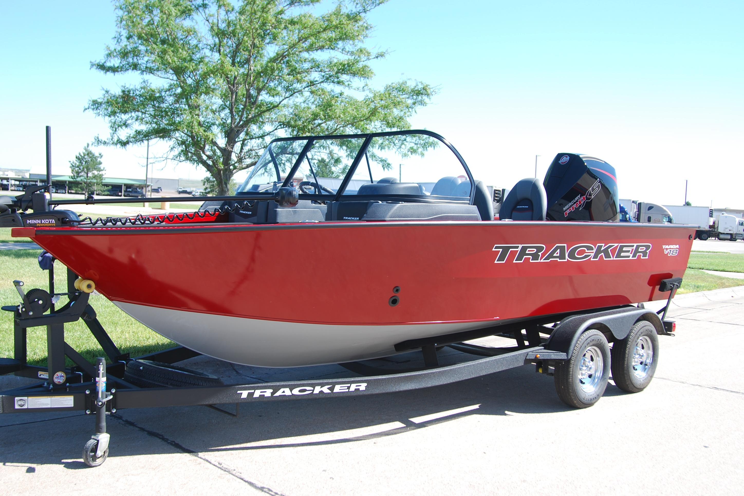 2026 Tracker Targa V-18 WT boat on trailer, red exterior, parked outdoors.