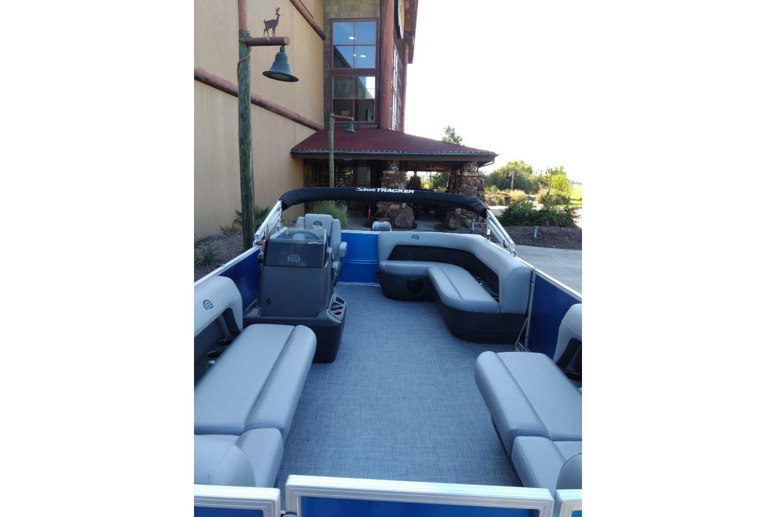 2026 Sun Tracker Party Barge 16 DLX pontoon boat with spacious seating and modern design.