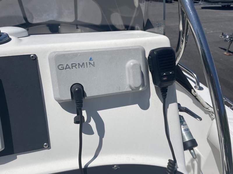 Garmin device and microphone on 2006 Boston Whaler 210 Outrage boat console.