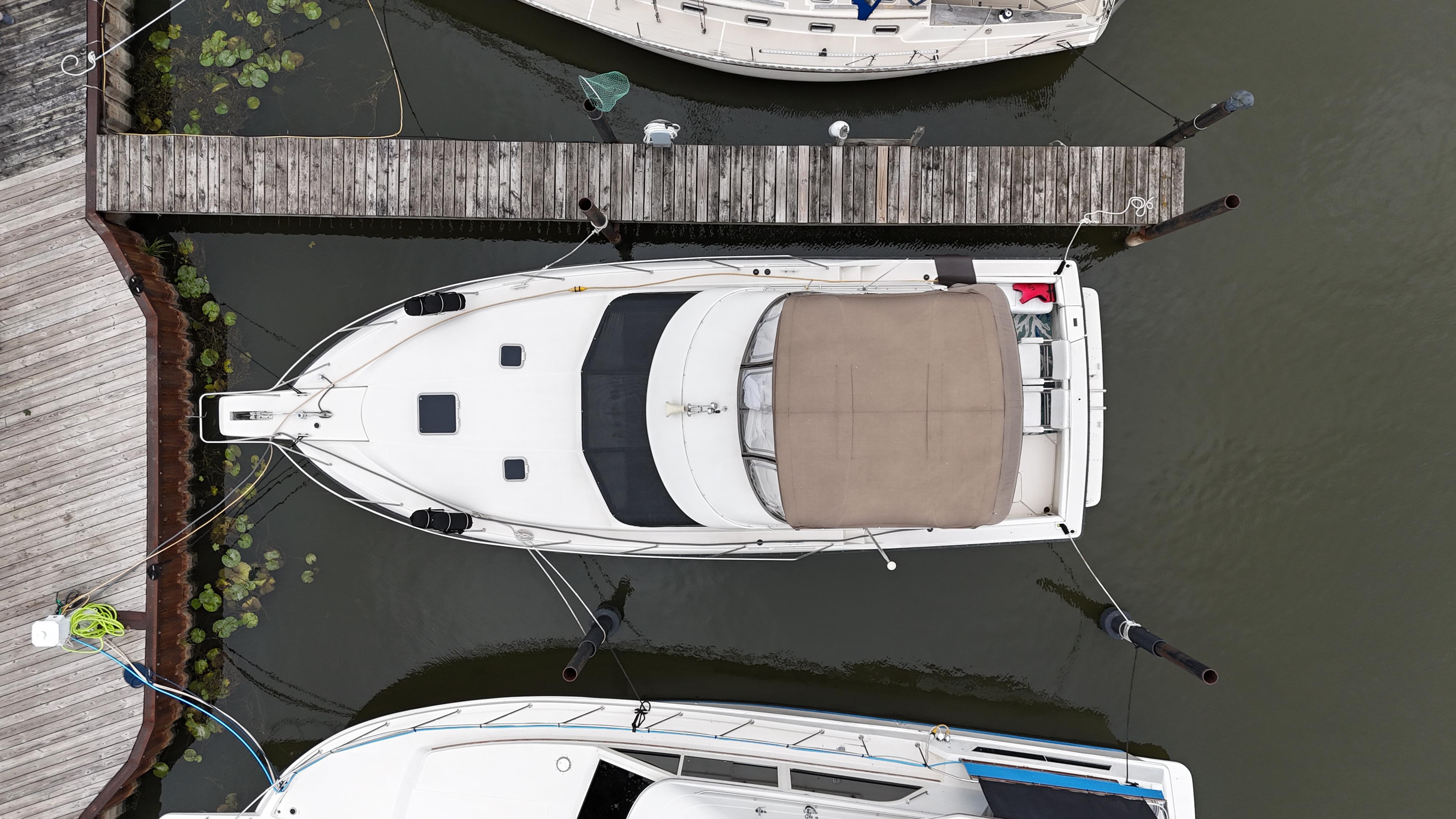 Aerial view of a 1991 Silverton 37 Motor Yacht docked at a marina.