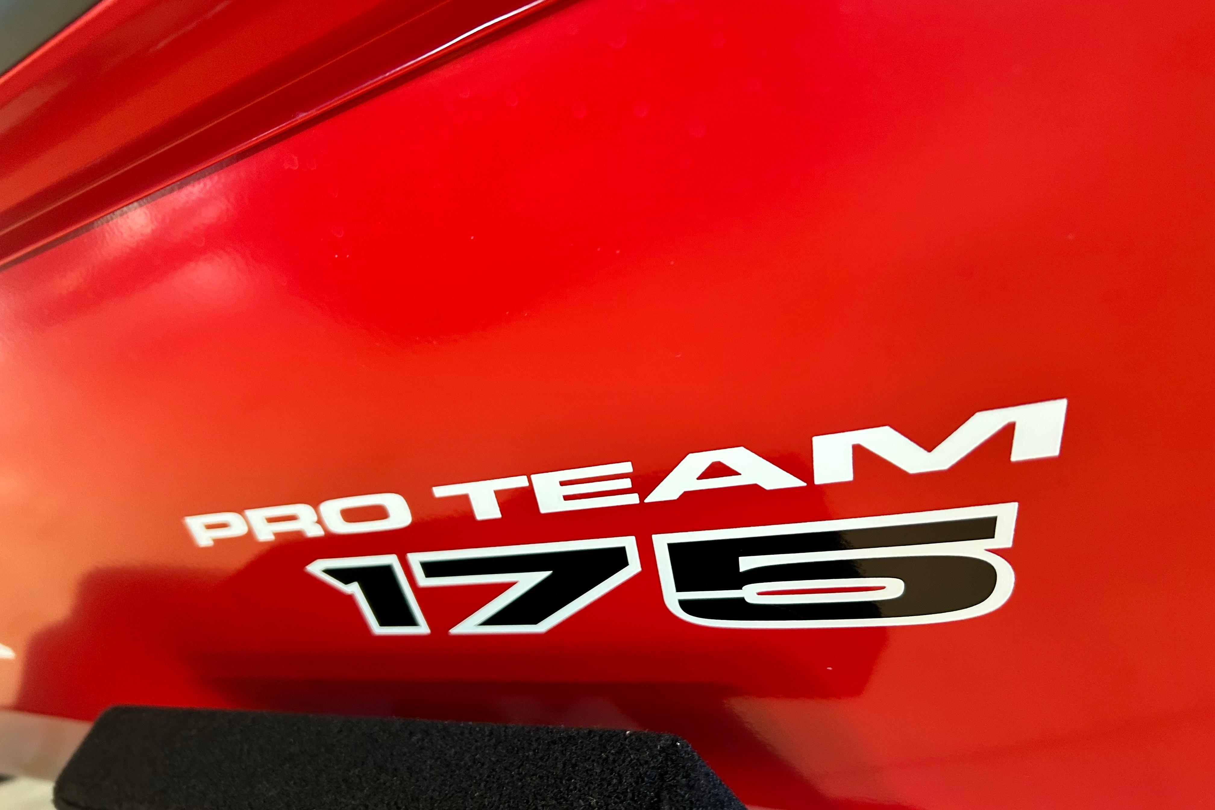 Red Tracker Pro Team 175 boat, model year 2026, close-up view.