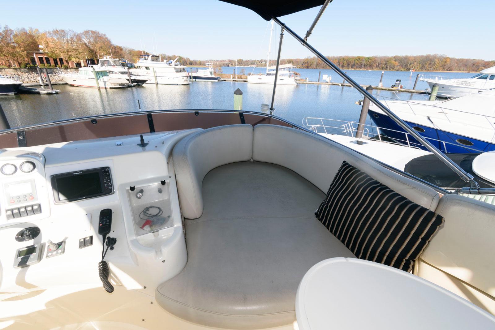 Azimut 50 Flybridge 2005 yacht interior with seating area and control panel.