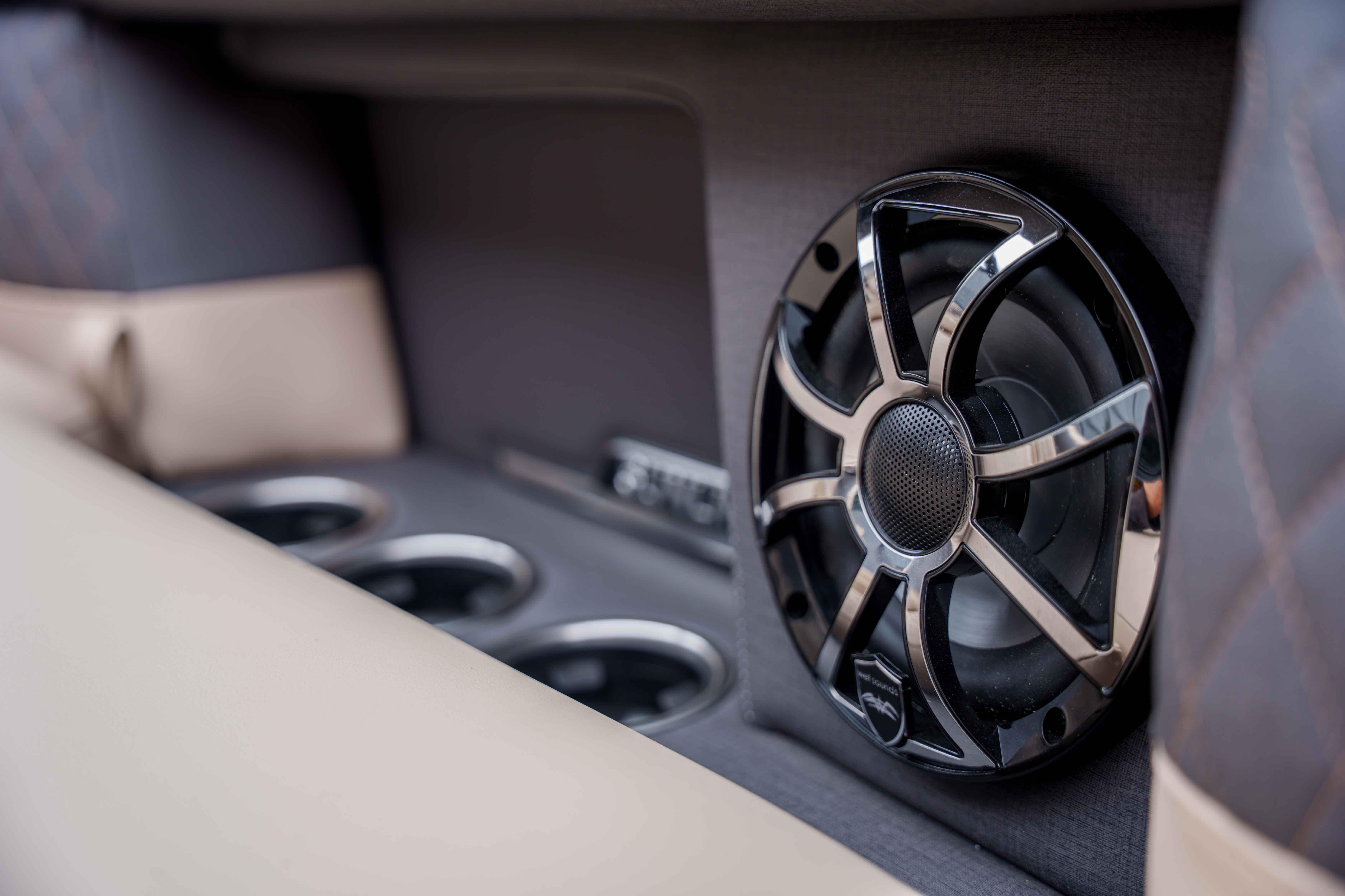 Speaker and cup holders in 2026 Harris Sunliner 230 boat interior.