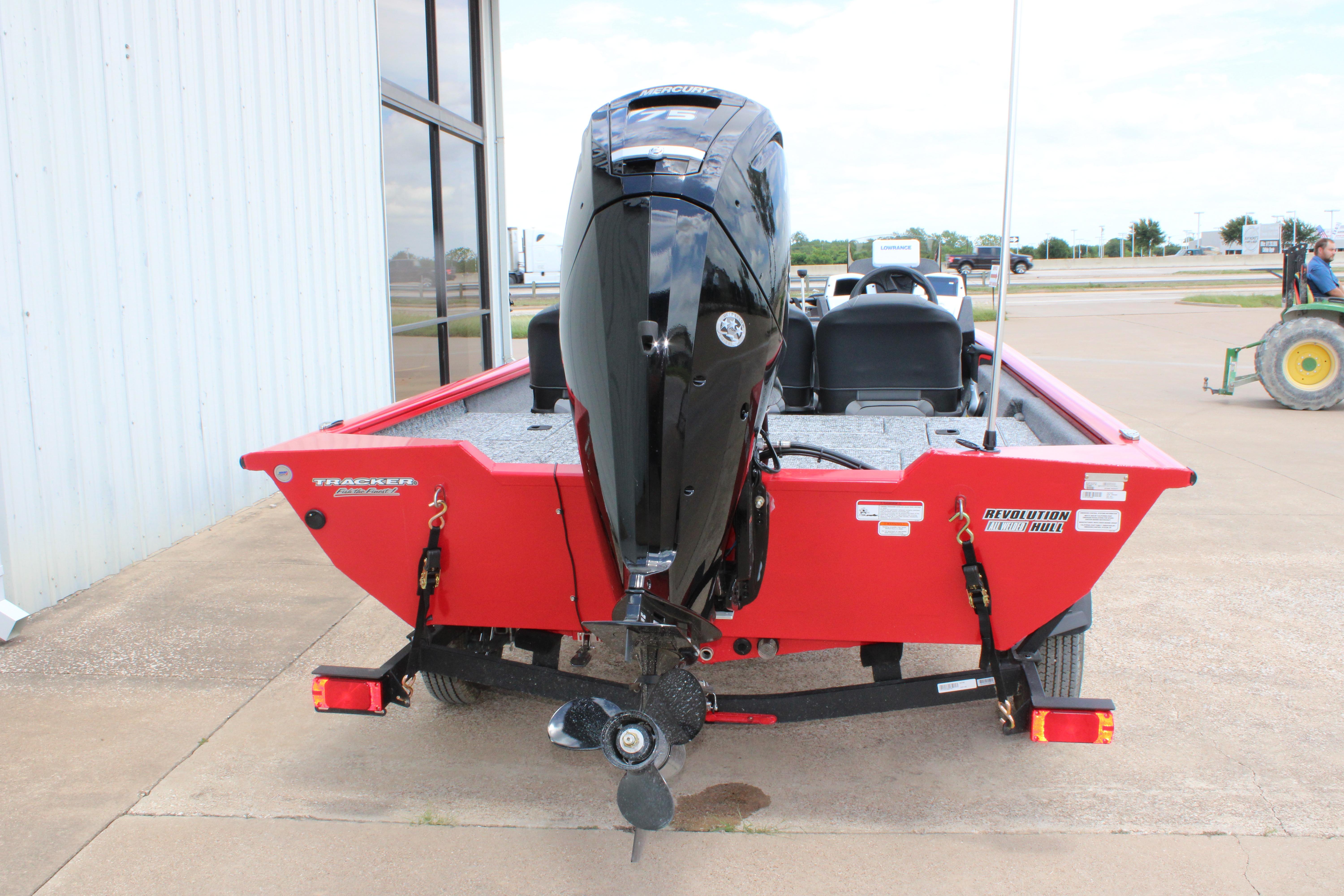 2026 Tracker Pro Team 175 Crappie Edition boat, red exterior, parked outdoors.