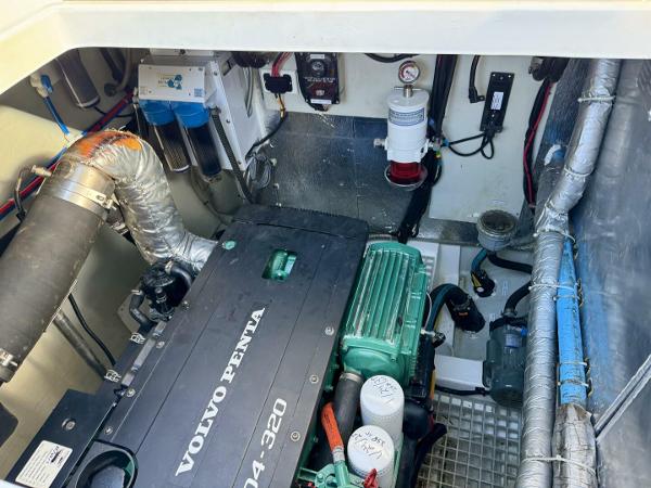 Engine room of 2022 Aquila 44 with Volvo Penta motor and various mechanical components.