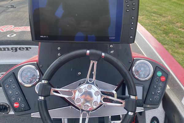2015 Ranger Z520C boat dashboard with steering wheel and electronic display.