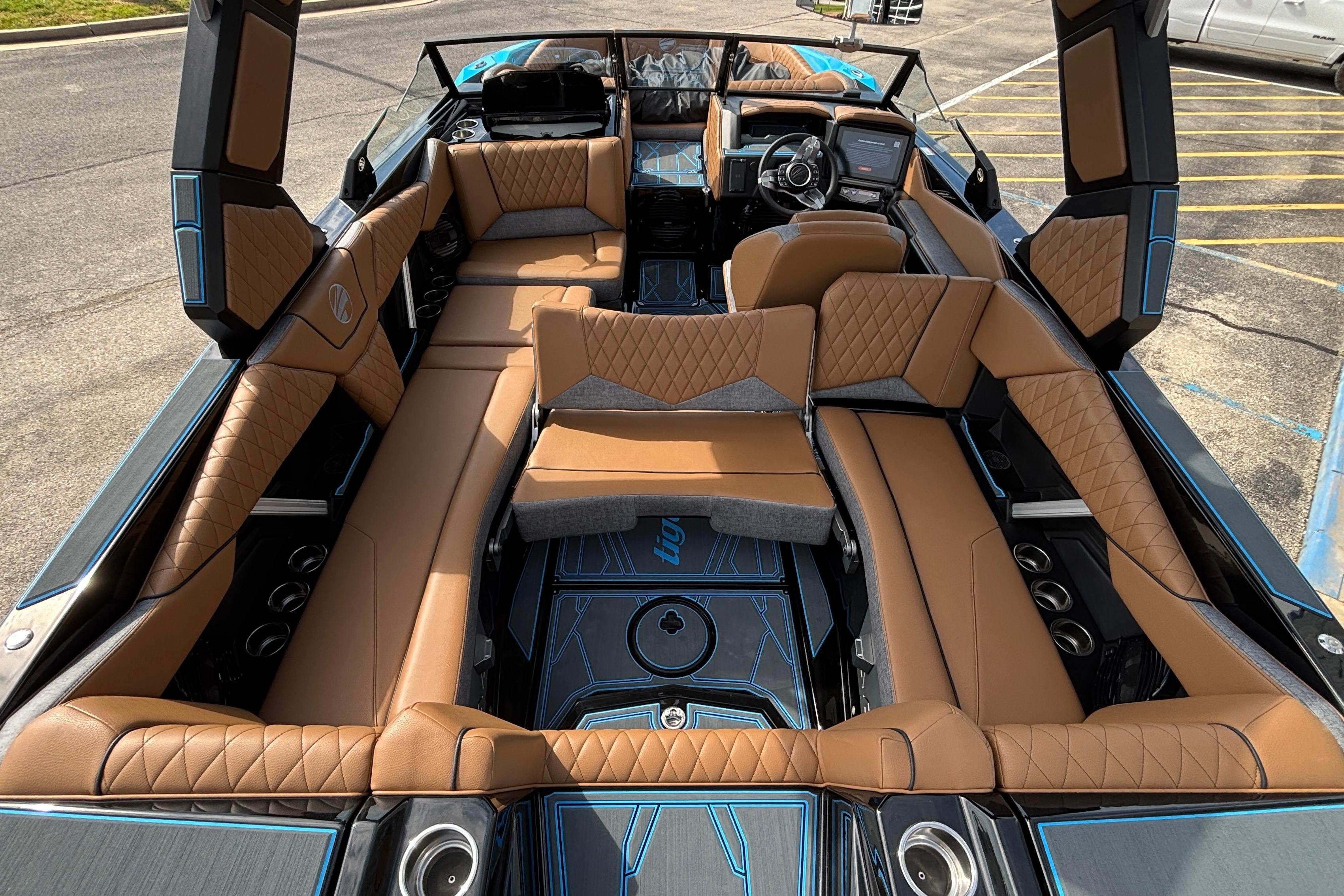 2026 Tigé Z3 boat interior with luxurious brown leather seating and modern dashboard.