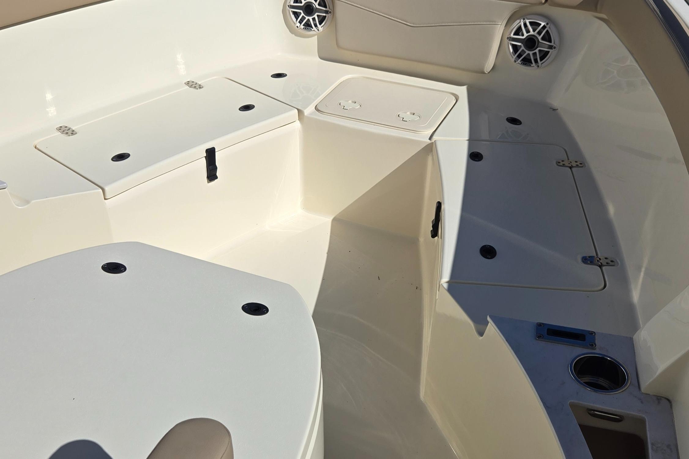 2024 Scout 240 XSF boat interior with storage compartments and speakers.