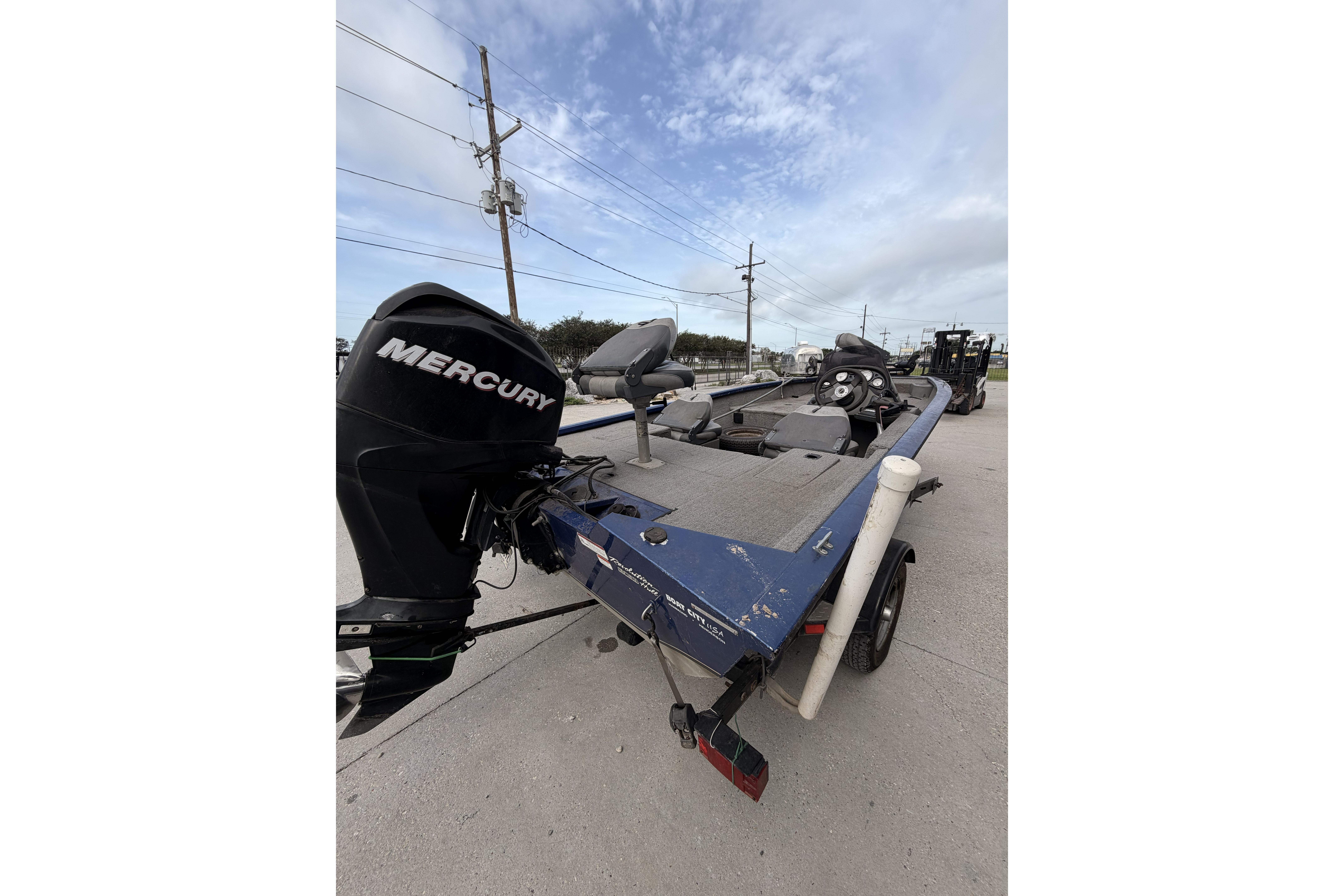 2012 Bass Tracker Pro 17 boat with Mercury engine on a trailer.