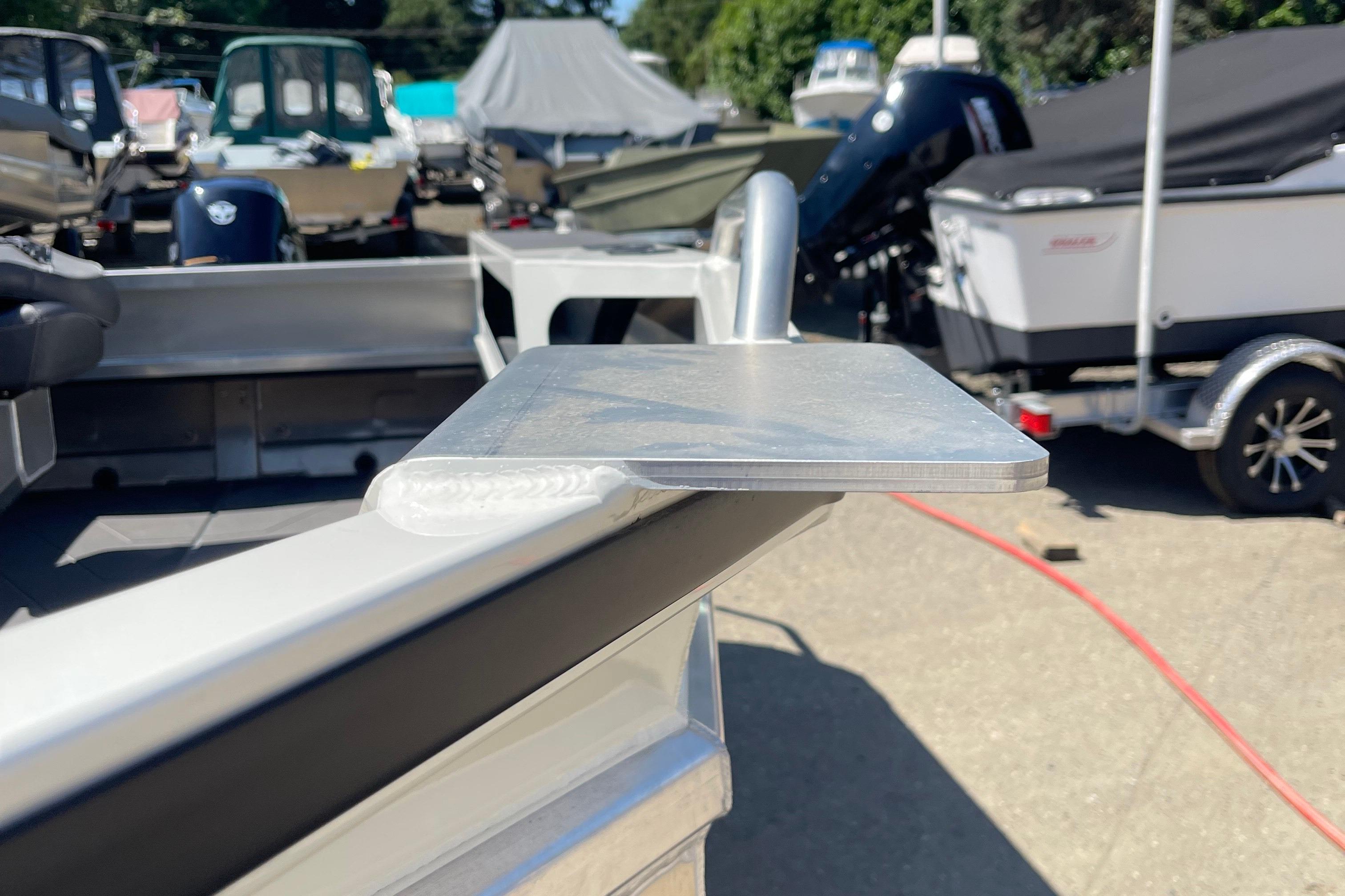 2024 Stabicraft 1450 Frontier boat detail, showcasing aluminum construction in a marina setting.