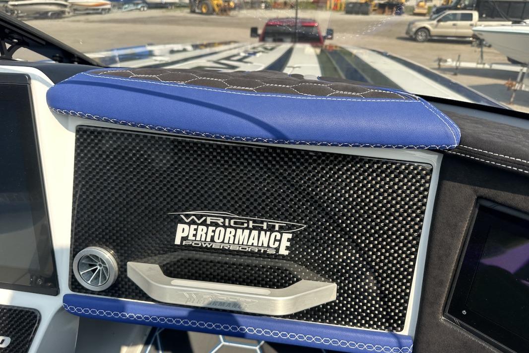 2018 Wright Performance 420 dashboard with carbon fiber panel and blue leather accents.