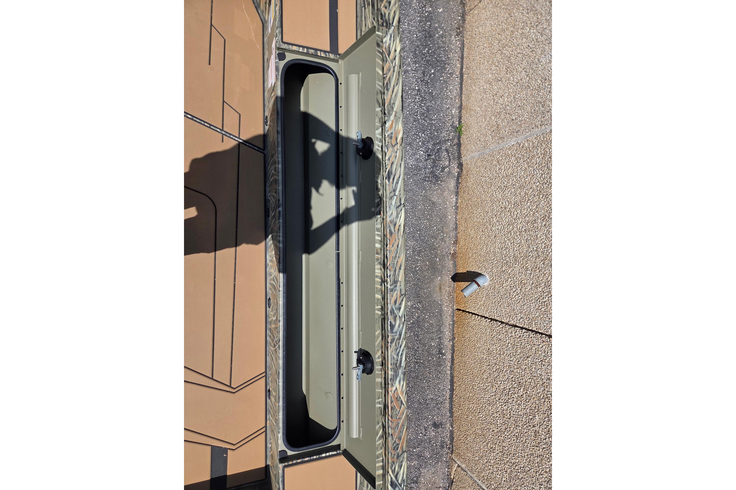 Open storage compartment on 2026 Tracker Grizzly 1756 T Marsh boat.