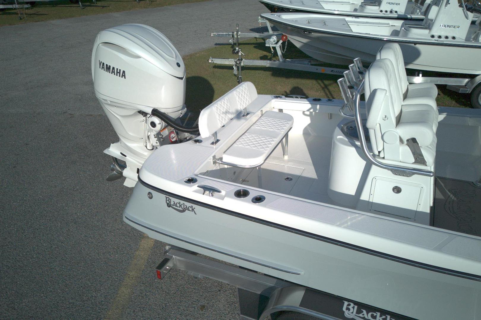 2026 BlackJack 256 Coastal boat with Yamaha outboard engine, featuring spacious seating.