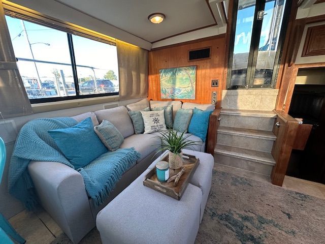 Interior of Carver 3807 yacht with cozy sofa and decor.