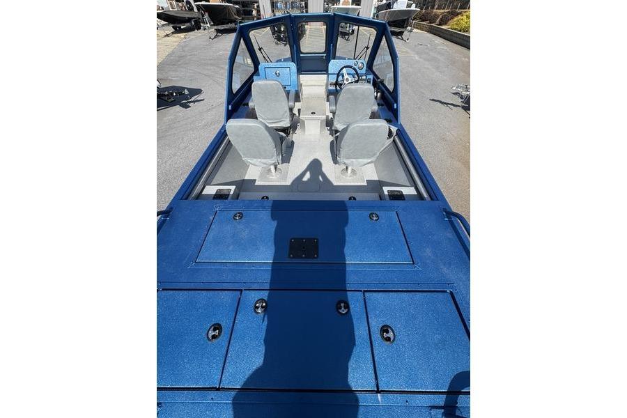 2026 SeaArk Dynasty 2.0 boat interior with blue deck and dual seats.