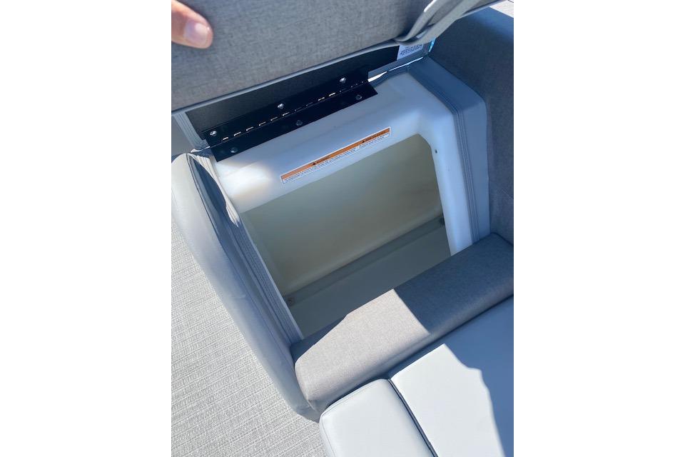 Open storage compartment in 2026 Manitou 23 AURORA RF VPII 575 boat seat.