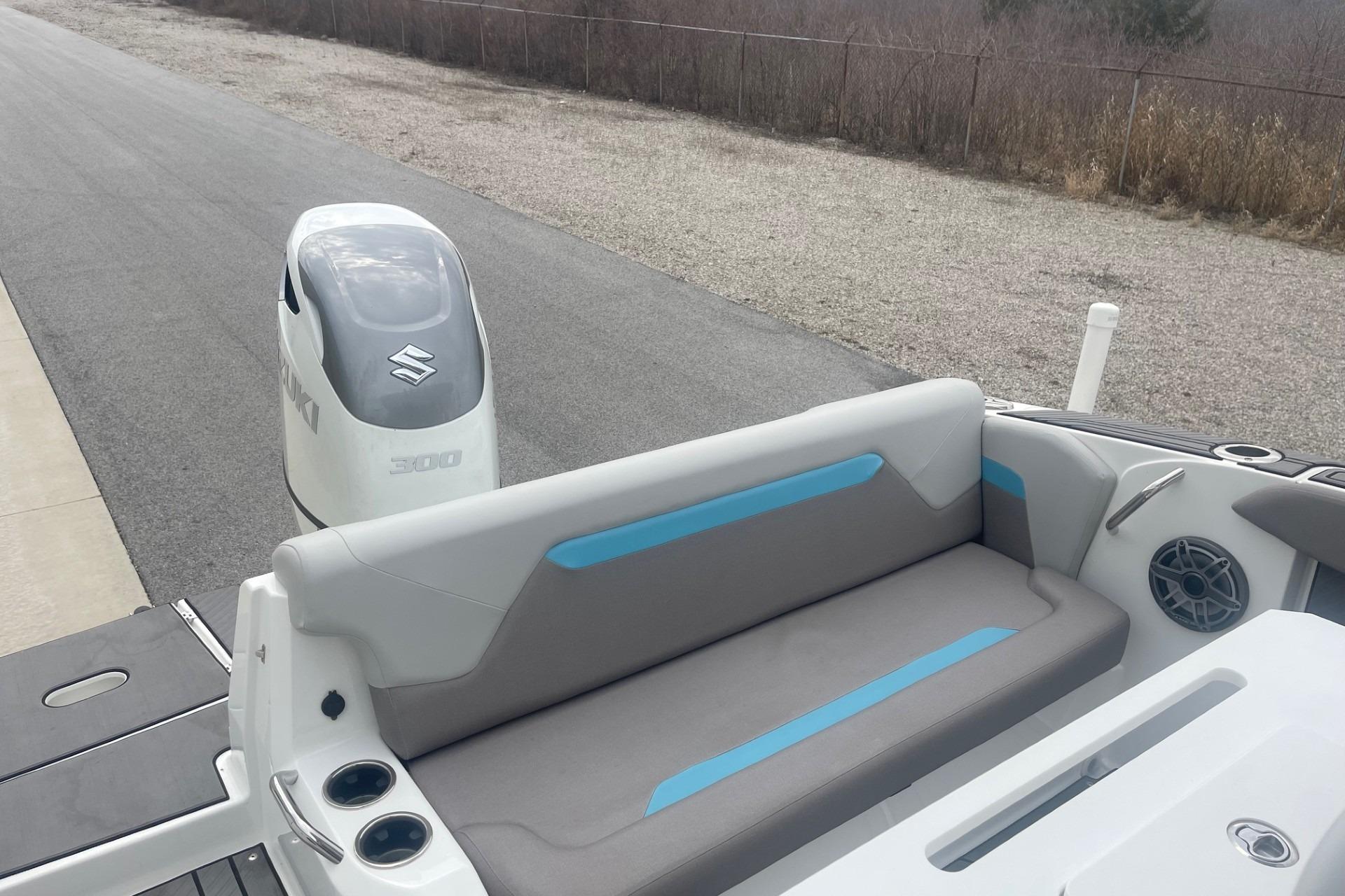 2025 Hurricane Center Console 24 OB boat with Suzuki 300 outboard motor, rear seating view.