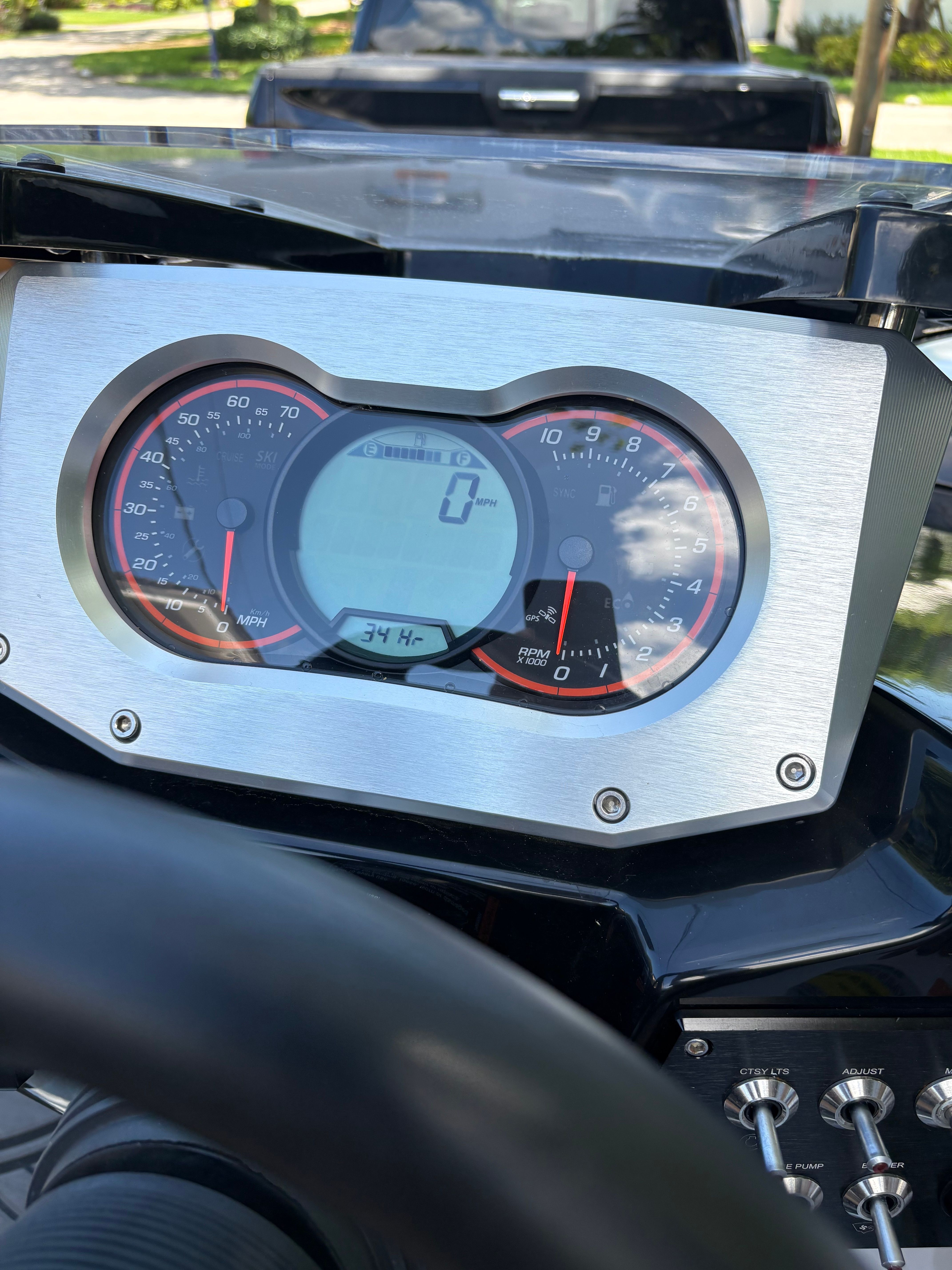 Dashboard of a Scarab 165 ID boat with speedometer and digital display.