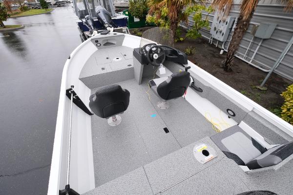 2024 Crestliner 1600 Vision boat interior with seating and steering console.