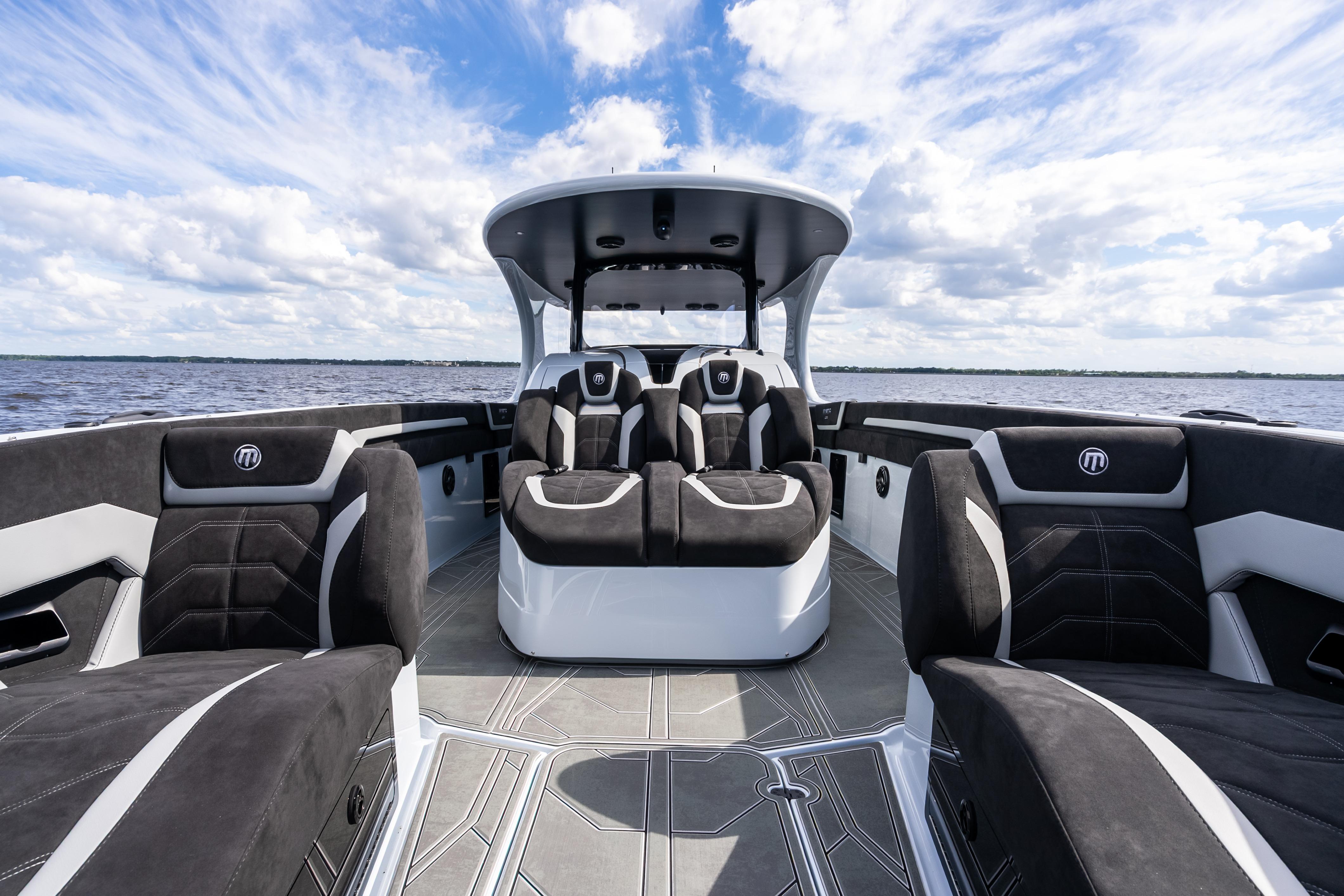 2027 Mystic Powerboats M4200 interior with luxurious seating and sleek design on open water.