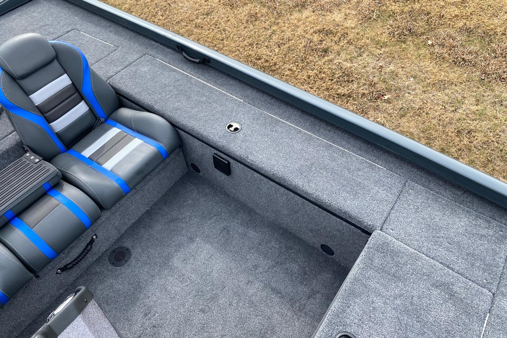 2026 Ranger RT188C boat interior with gray and blue seating, carpeted deck.