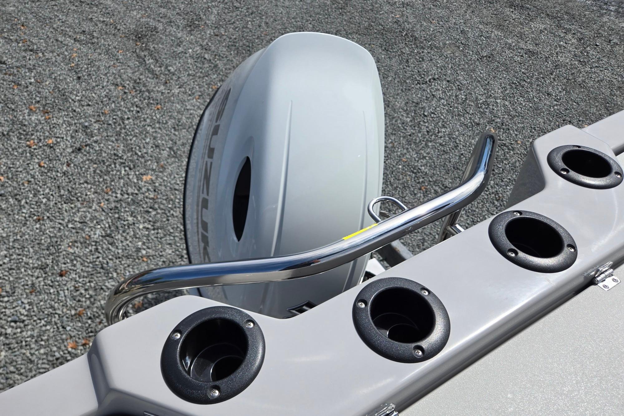 2026 Godfrey Sweetwater 2286 FS boat with Suzuki outboard motor and rod holders.