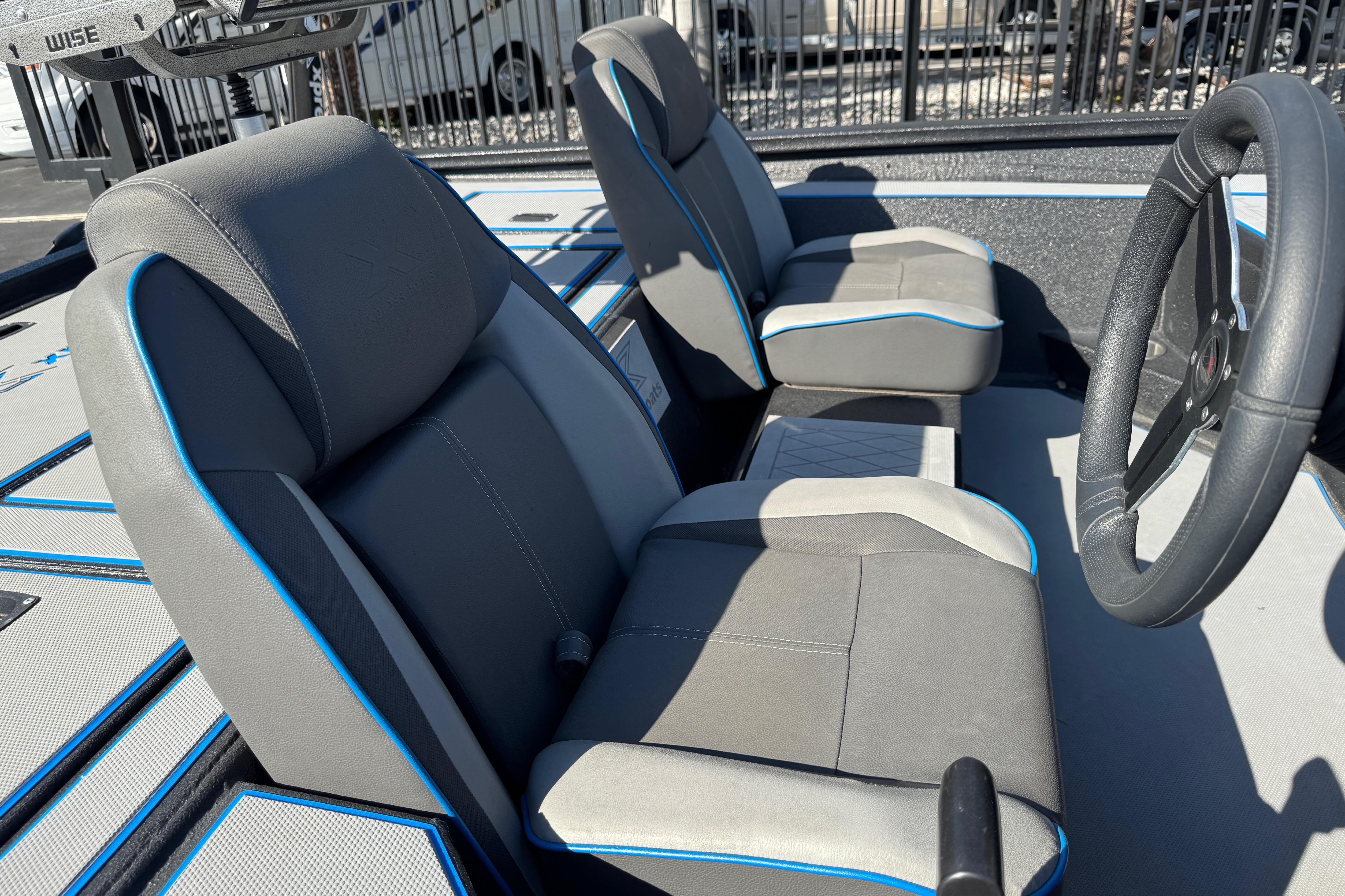 2025 Express H20 boat interior with gray seats and blue accents.