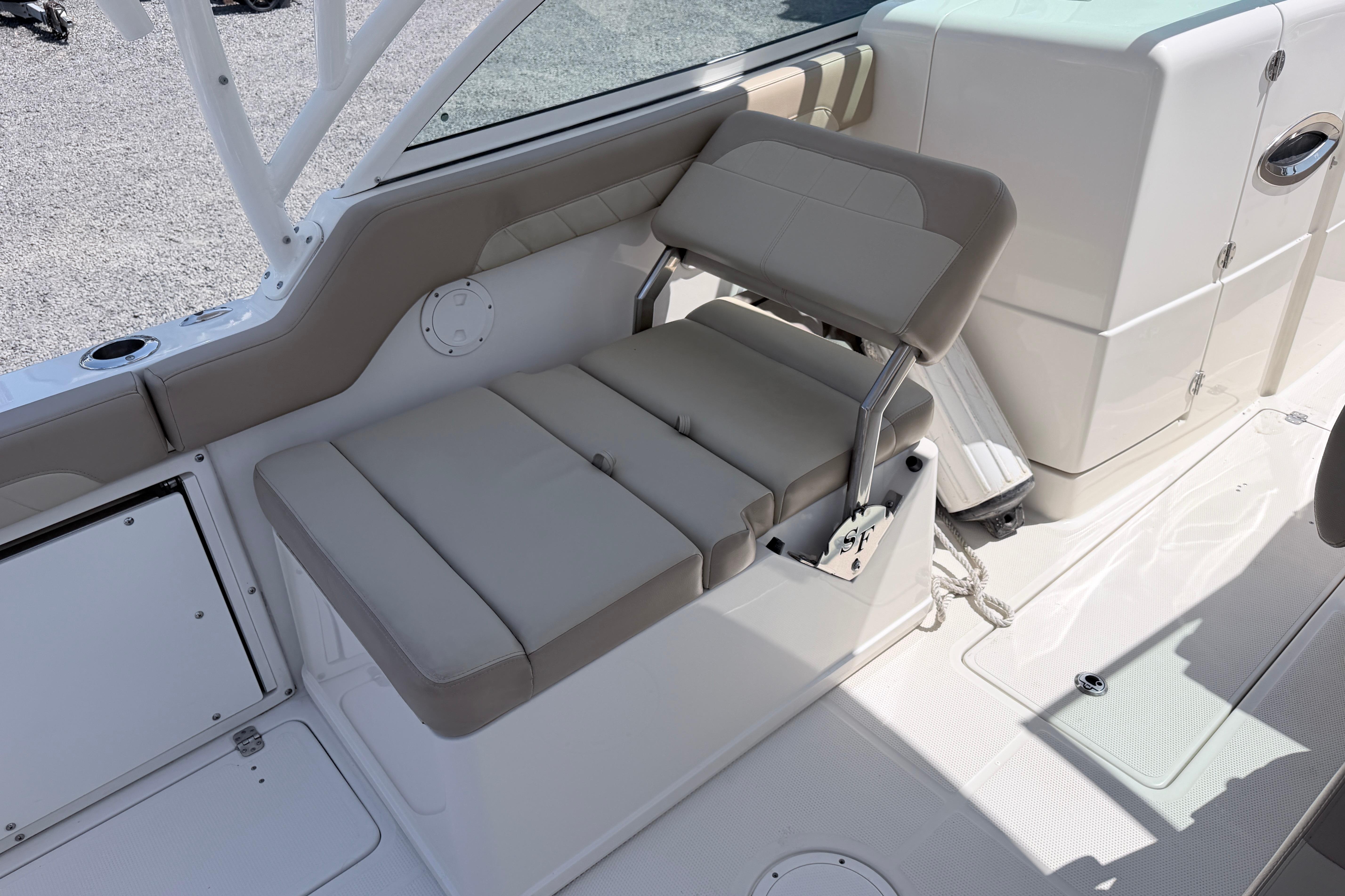 2021 Sailfish 245 DC boat interior with beige seating and modern design.