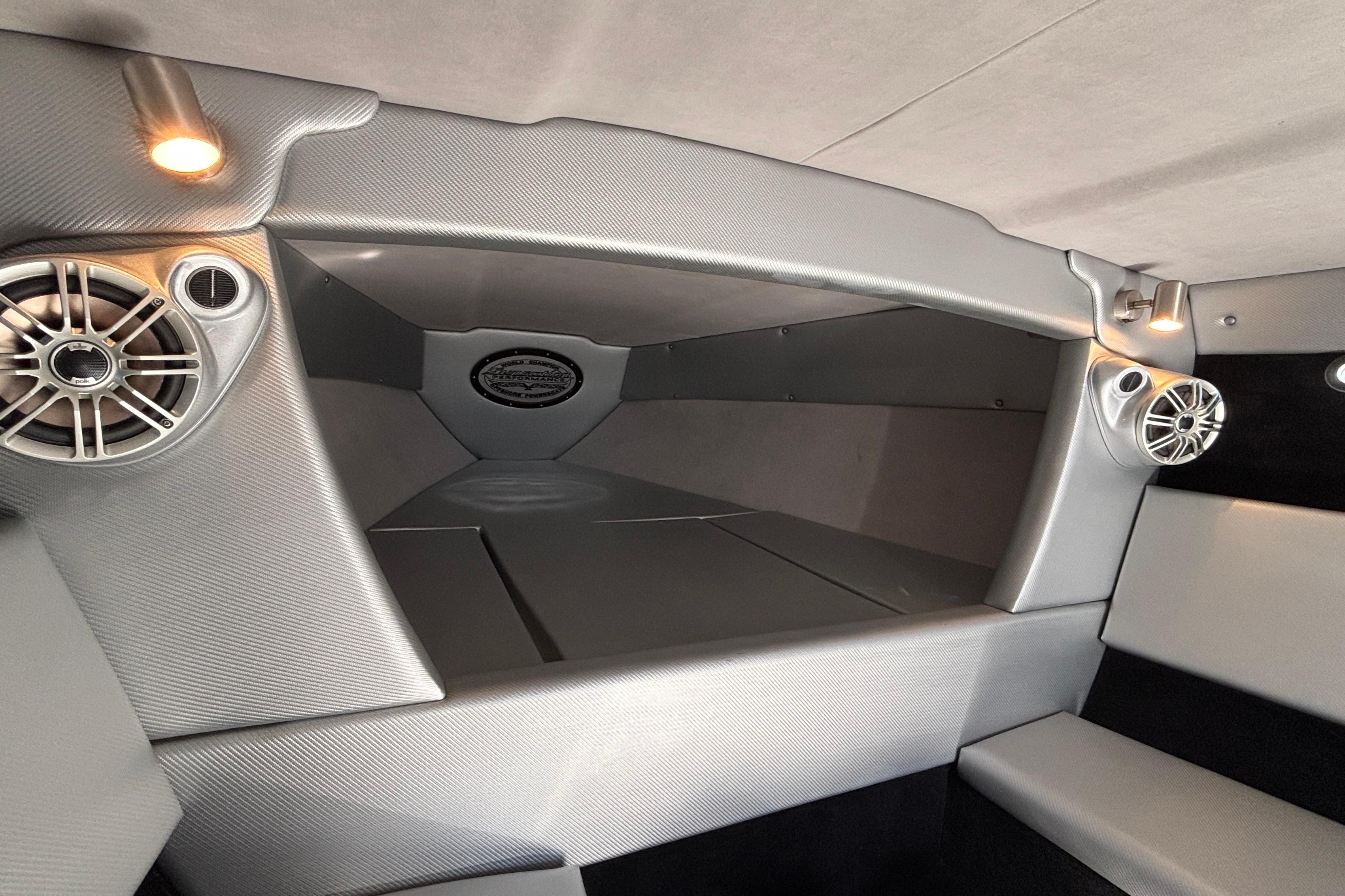 Interior cabin of 2013 Sunsation 36 XRT boat with modern speakers and lighting.