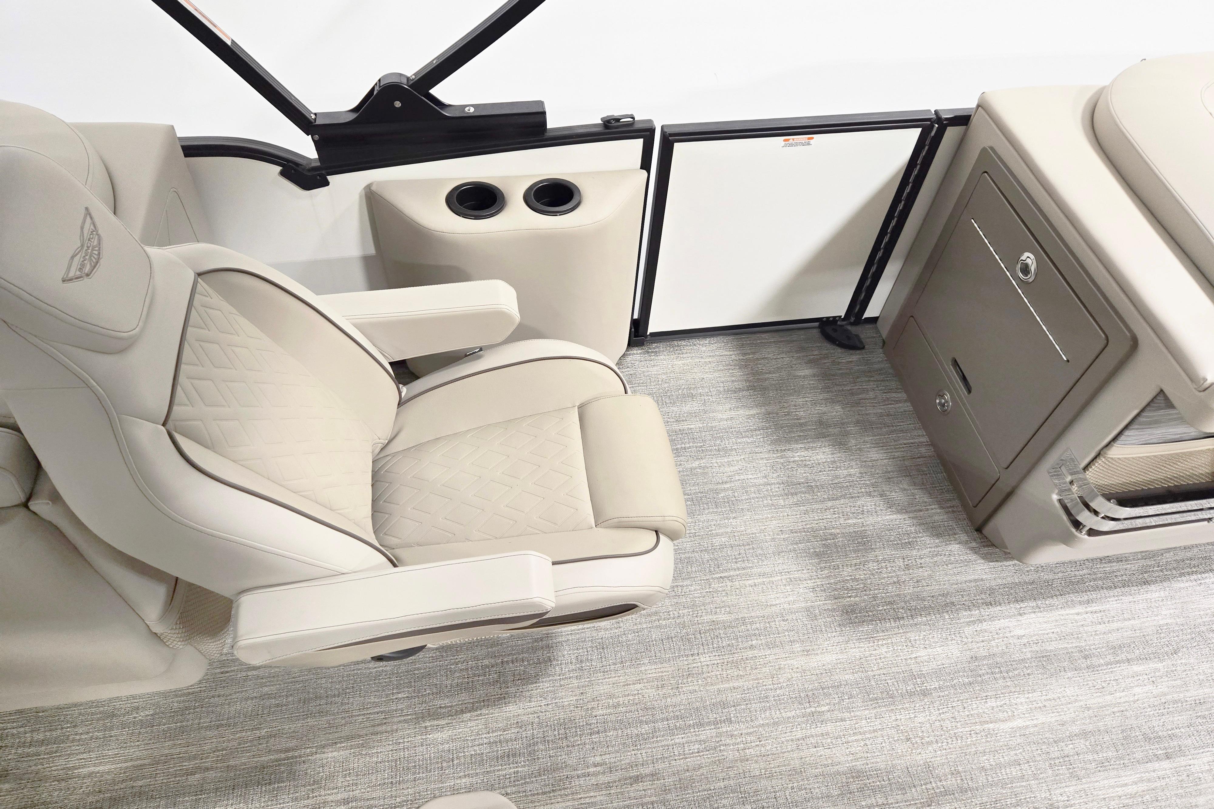 Luxurious interior of 2026 Bennington 24 M boat with plush seating and storage.