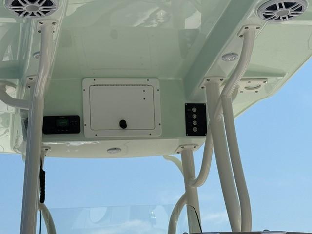 2025 Sea Born LX24 Center Console boat's overhead console with speakers and controls.