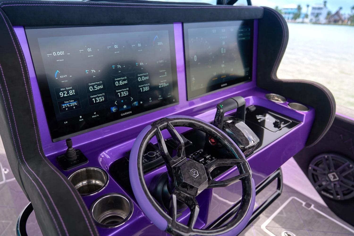 Manufacturer Provided Image: Purple dashboard of 2026 Statement 380 Open boat with dual screens and steering wheel.