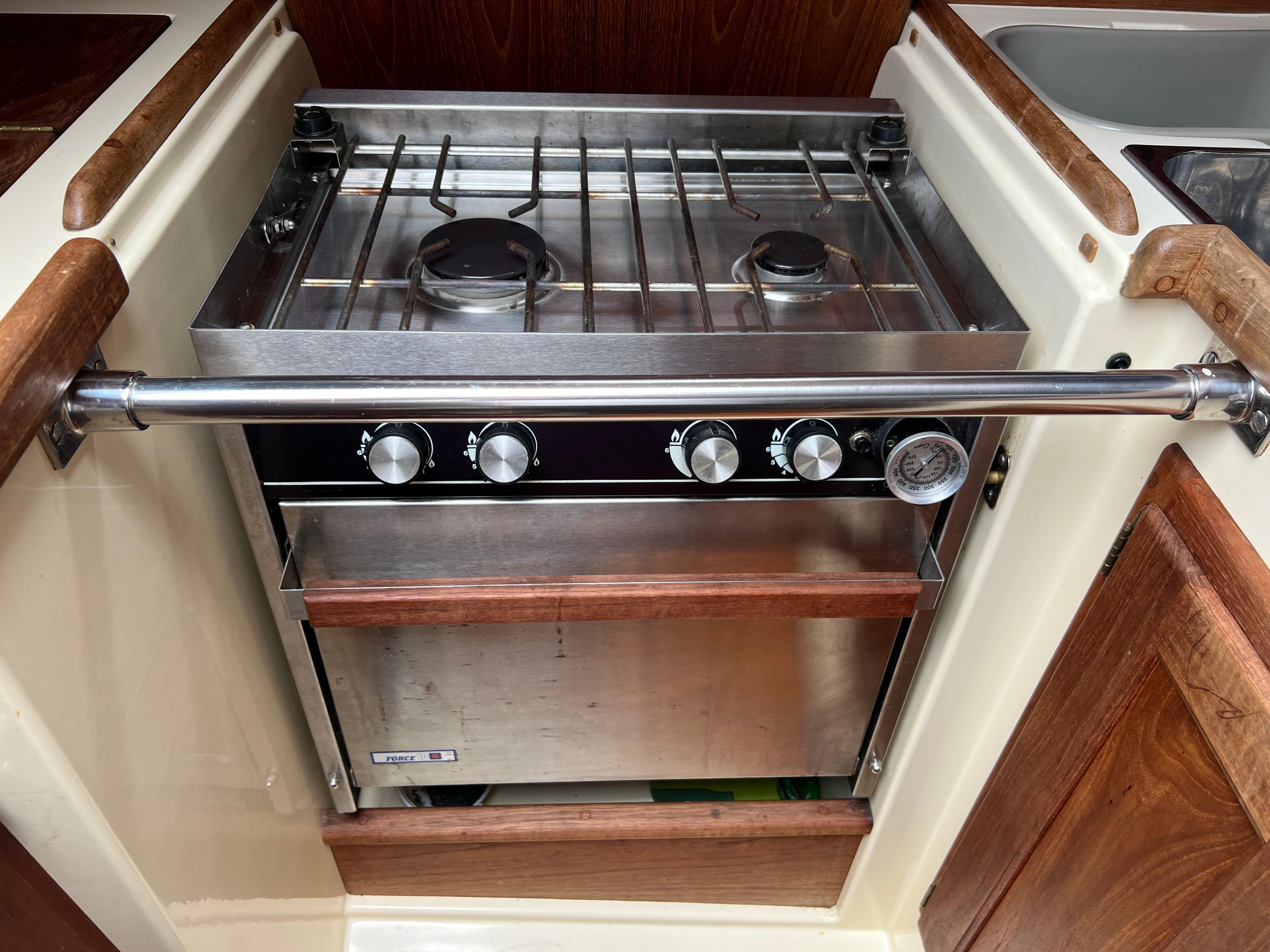Stainless steel stove and oven in 1994 Pacific Seacraft 34 sailboat galley.