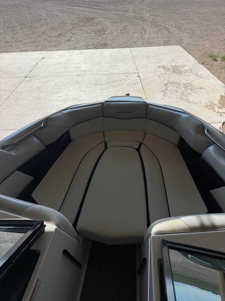The image shows the bow area of a 2015 Moomba Mojo boat with cushioned seating.