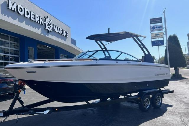 2025 Chaparral 247 SSX boat on trailer at Modern Marine dealership.