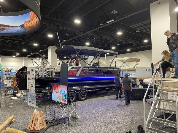 2022 Starcraft SLS-3Q DH pontoon boat displayed at an indoor boat show.