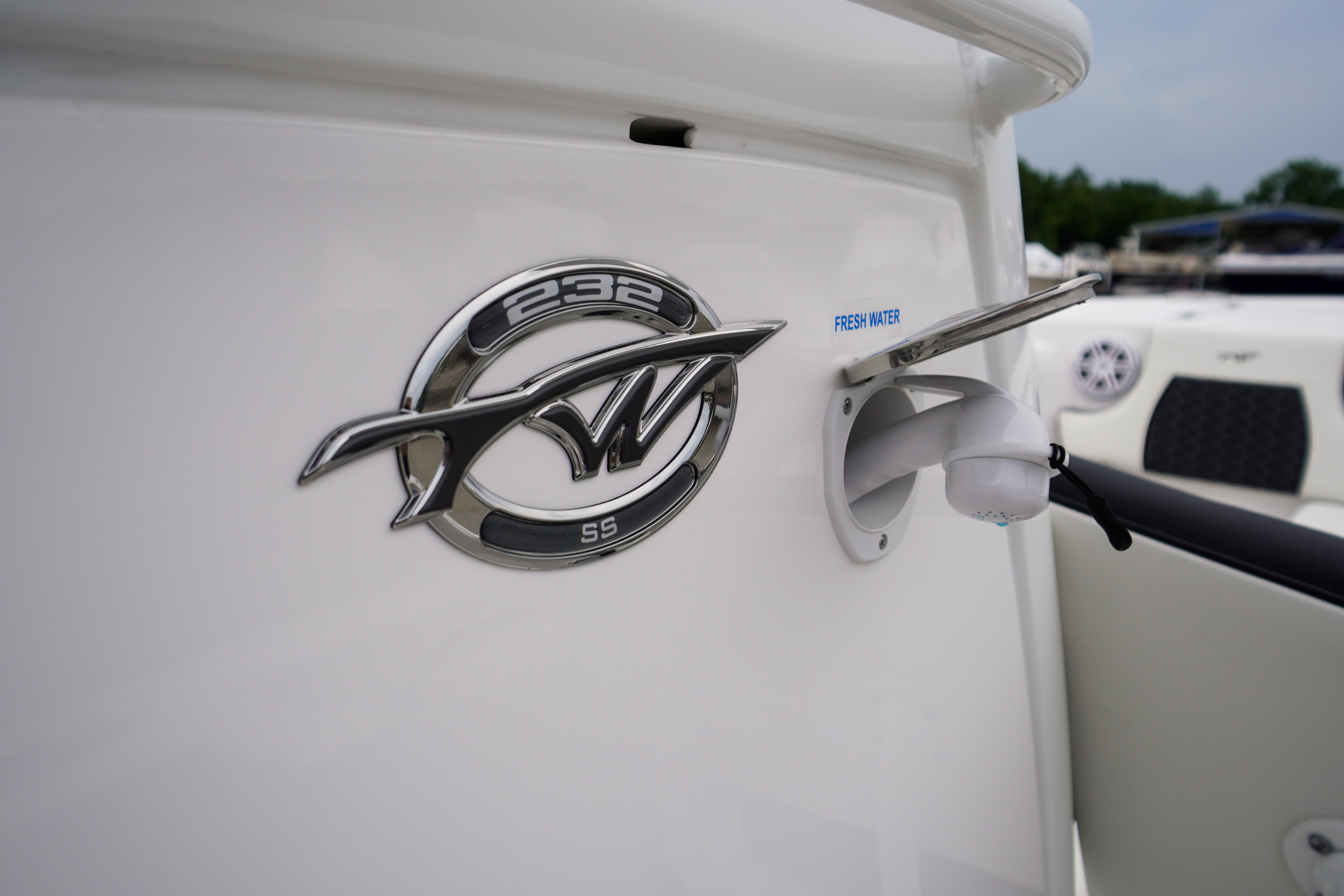 2026 Tidewater 232 SS boat emblem and fresh water inlet detail.