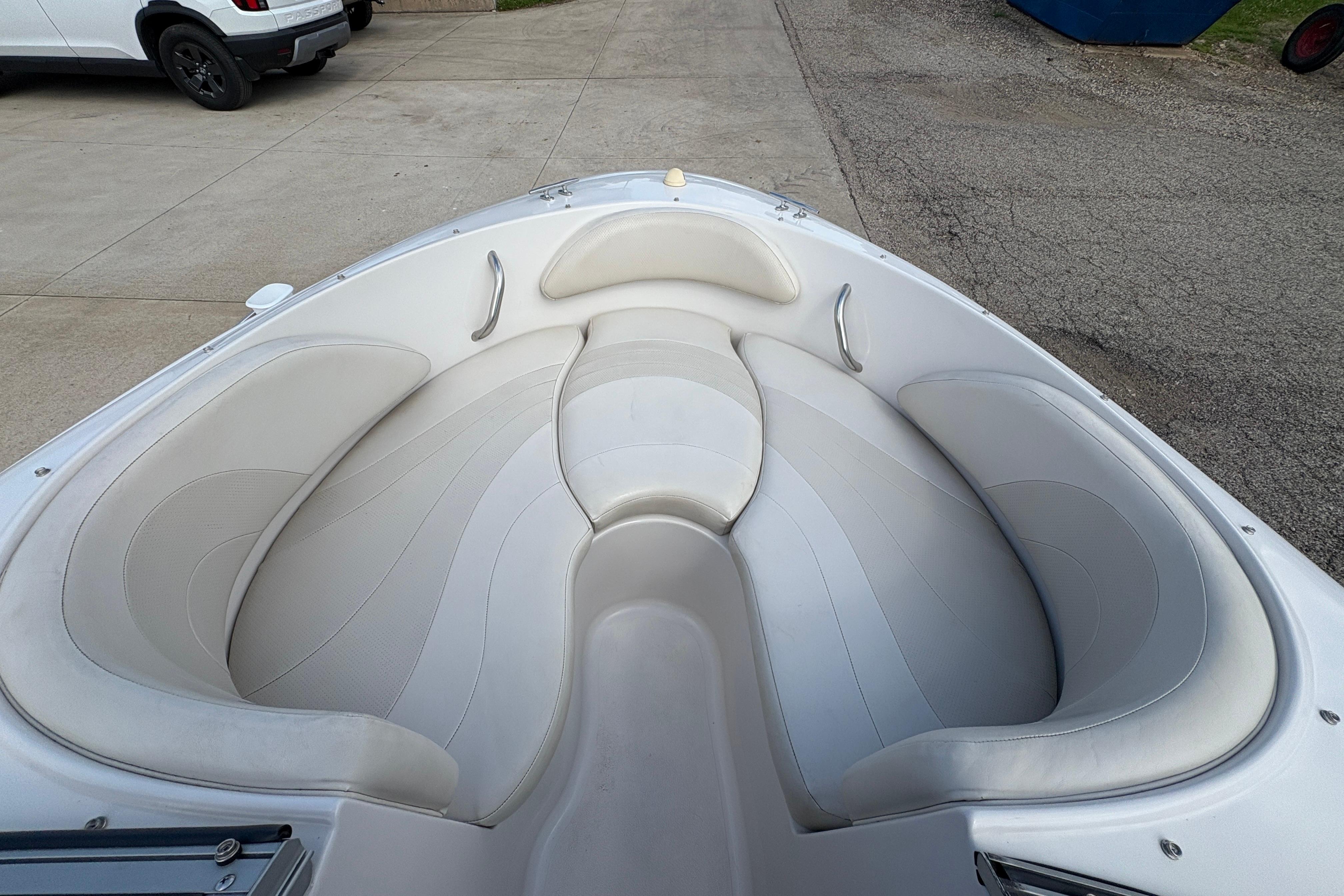 2005 Starcraft C-Star 1700 OB boat with spacious white seating area.
