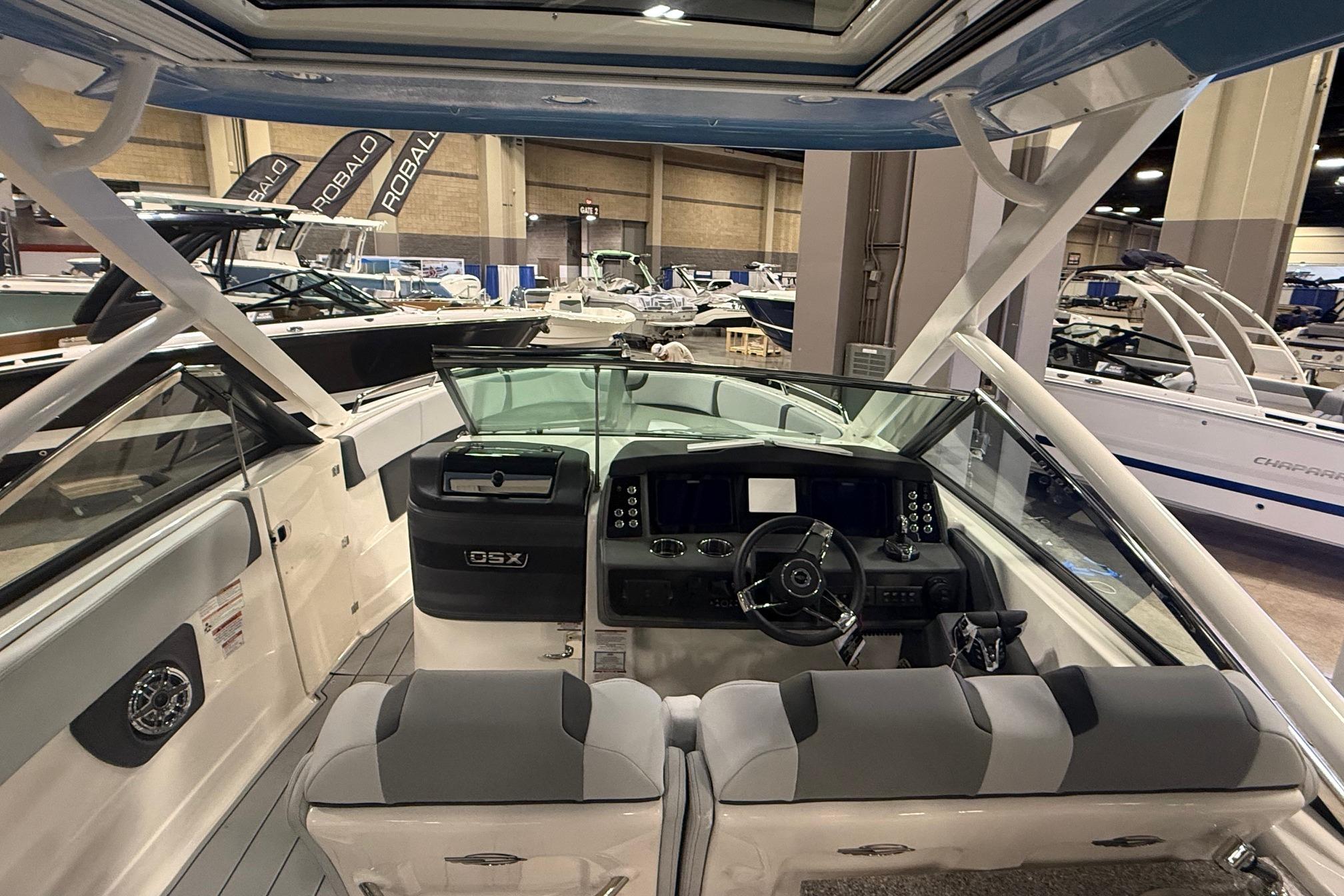 2026 Chaparral 280 OSX boat interior at a boat show, showcasing modern design and controls.