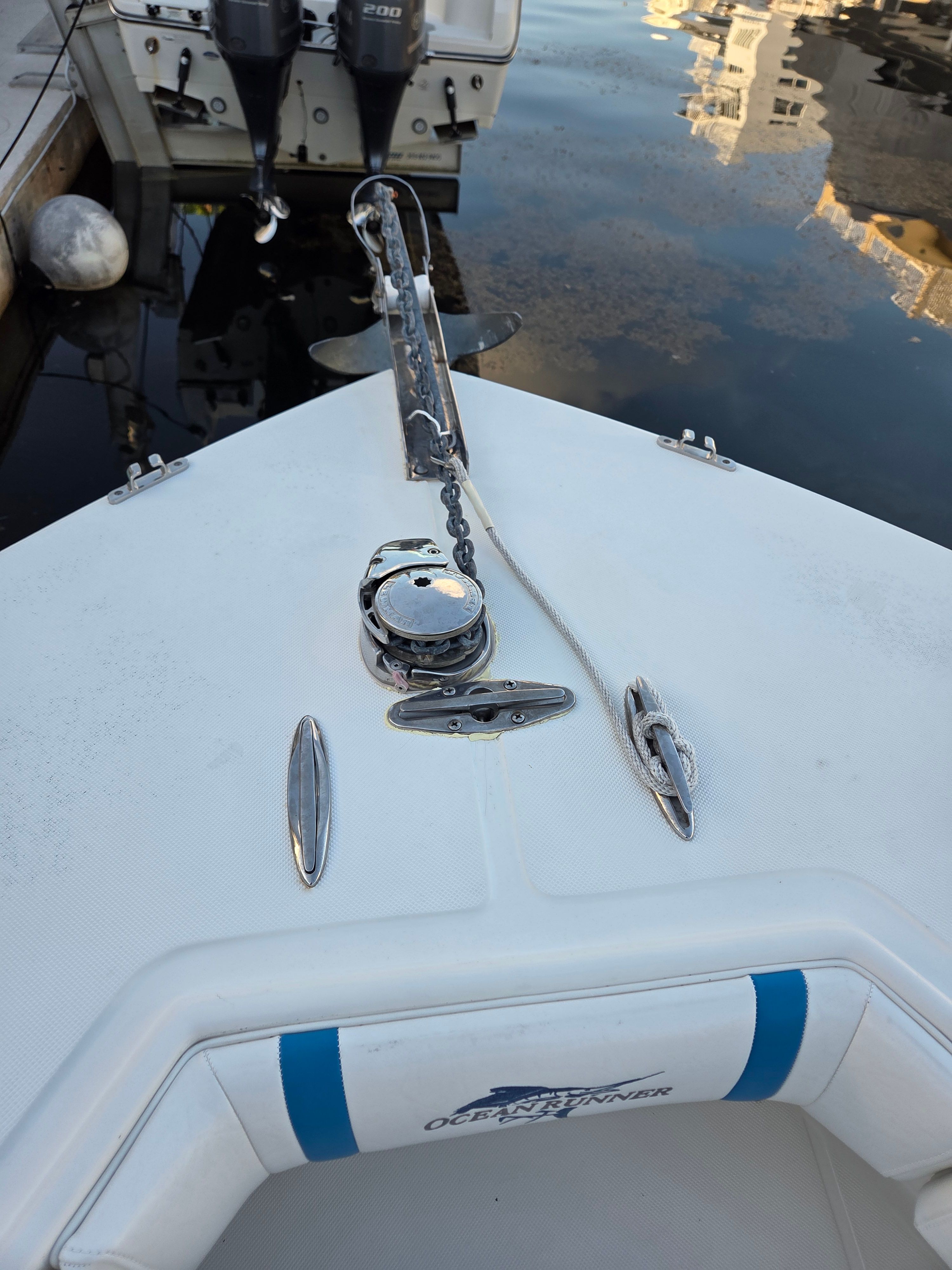 Bow of an Ocean Runner 29 boat in harbor, year 2012.