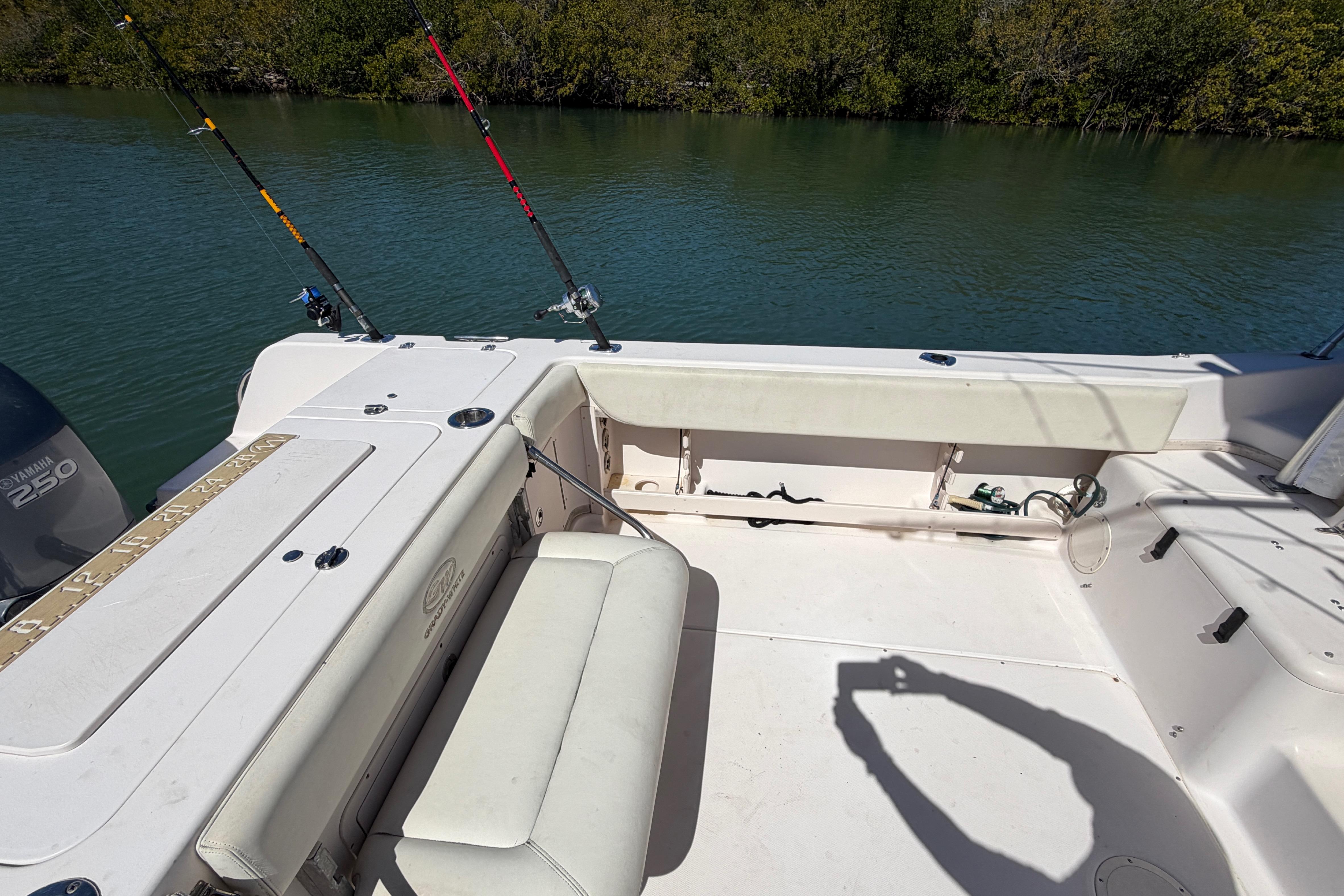2006 Grady-White Sailfish 282 boat deck with fishing rods and Yamaha 250 engine.