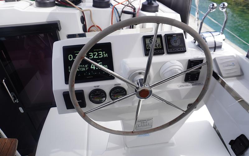 Steering wheel and controls of 2022 Fountaine Pajot Elba 45 catamaran.