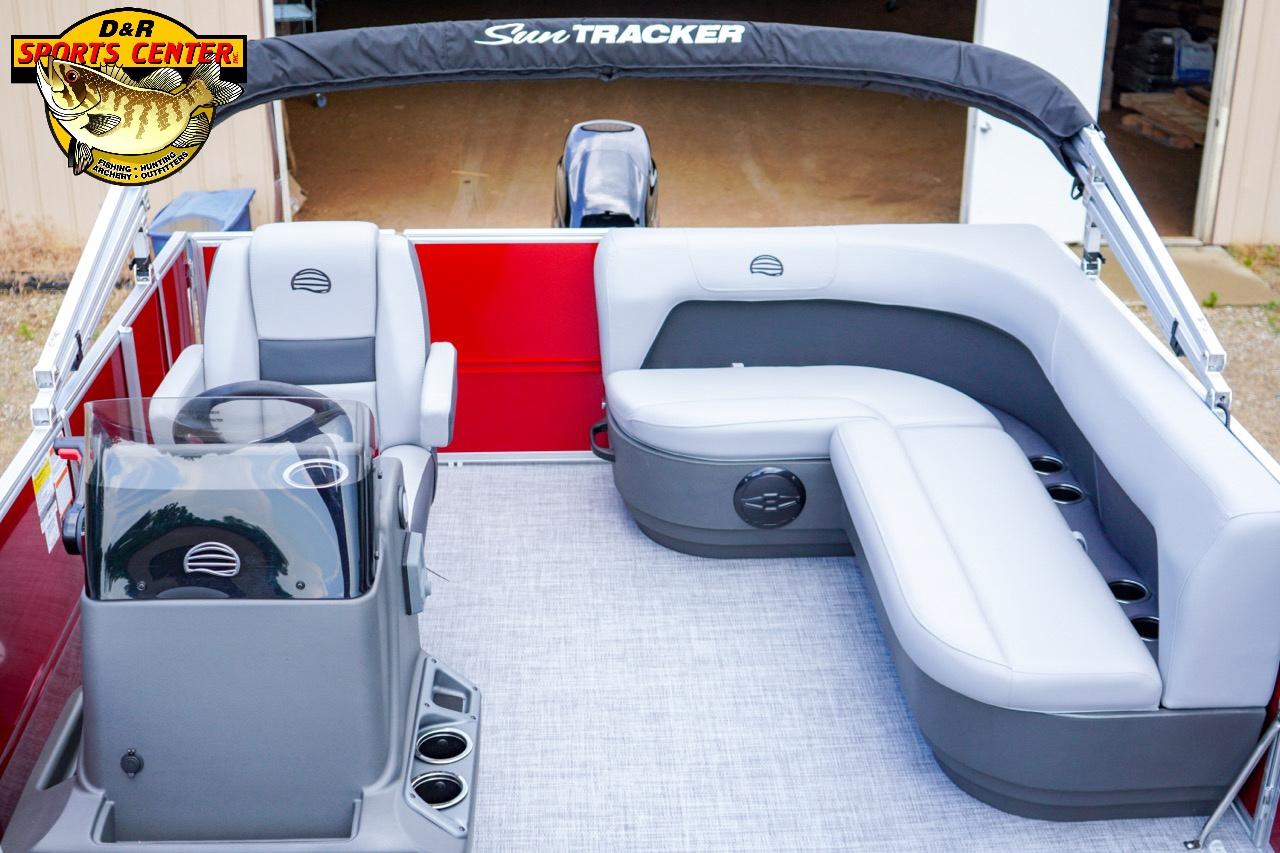 2026 Sun Tracker Party Barge 16 interior with seating and steering console, showcased at D&R Sports Center.