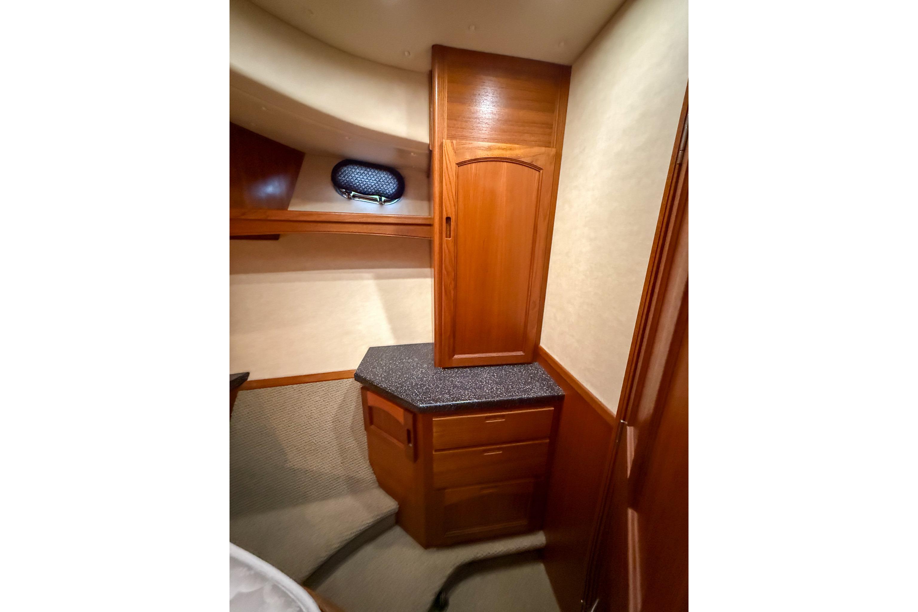 Interior of 2007 Nordic Tug 54, featuring wooden cabinetry and carpeted flooring.