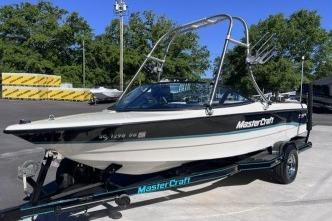 1996 MasterCraft ProStar 190 boat on trailer in outdoor setting.