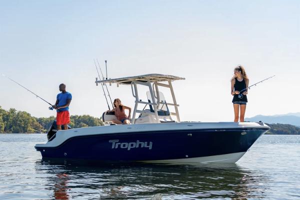 Manufacturer Provided Image: 2025 Bayliner Trophy T22CC boat with people fishing on calm water.